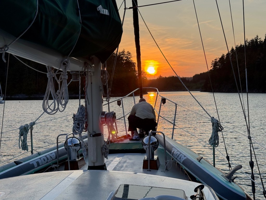 David securing our anchor as the sun sets on Pott's Lagoon.