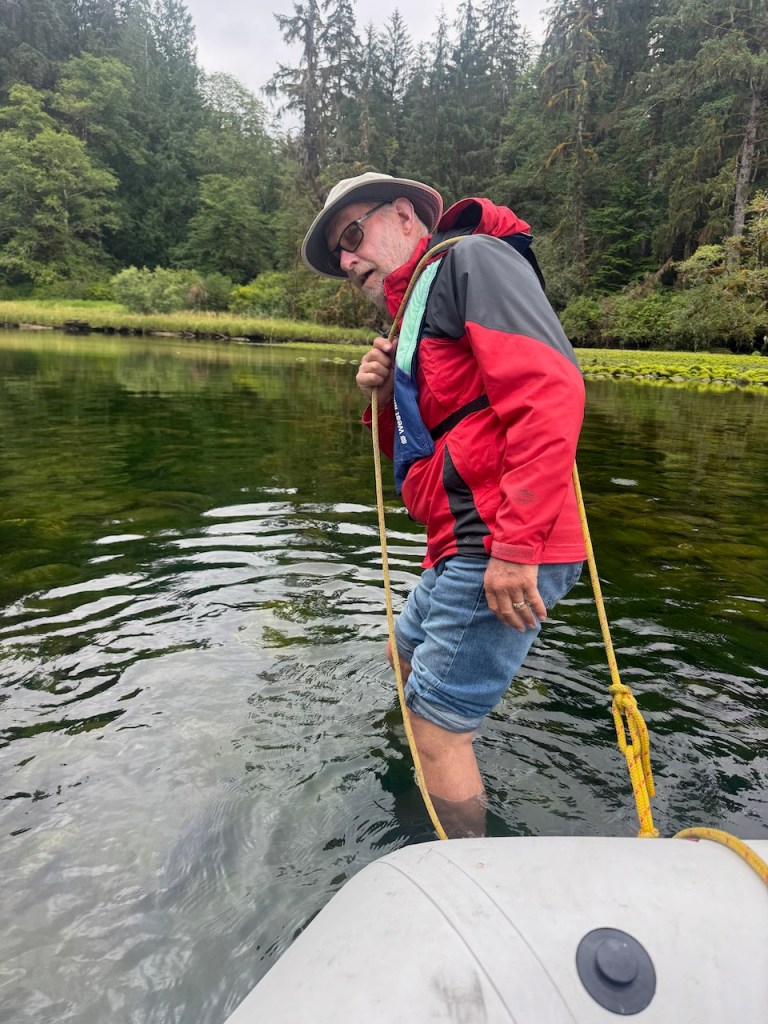 David pulling dingy through shallows at the entrance to Marble Canyon.