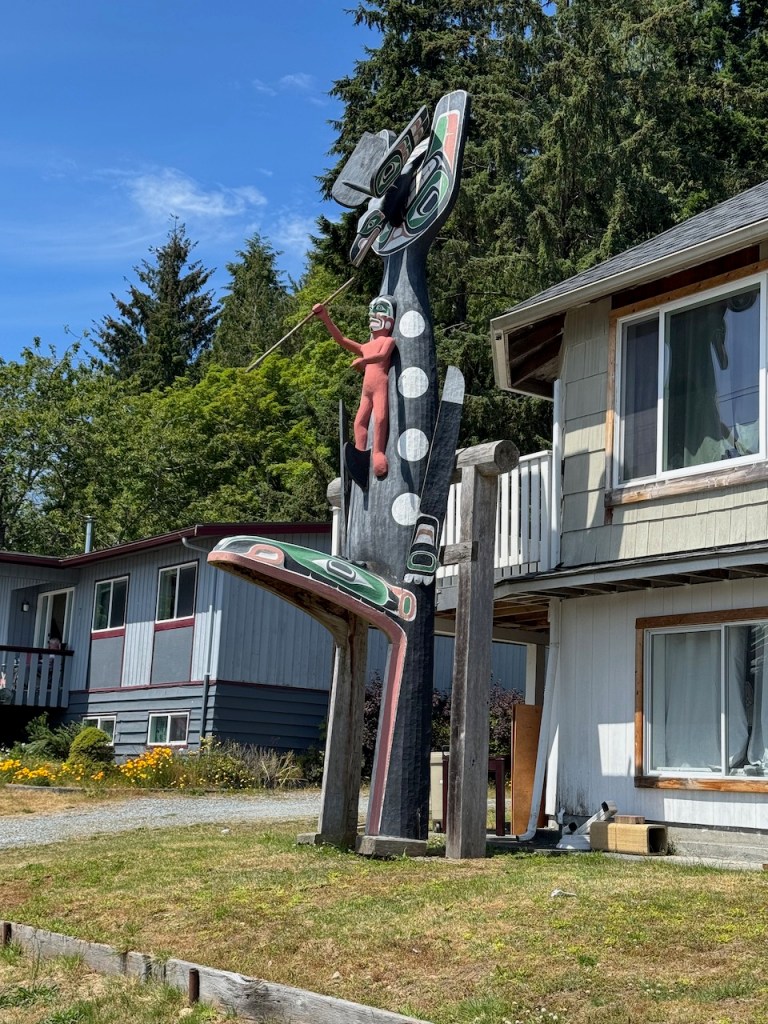 Totem in front of home in Alert Bay.